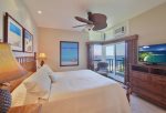 The second bedroom features a private lanai, king bed, TV and stunning views